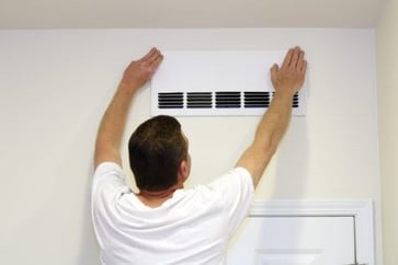 Man installing hepa filter